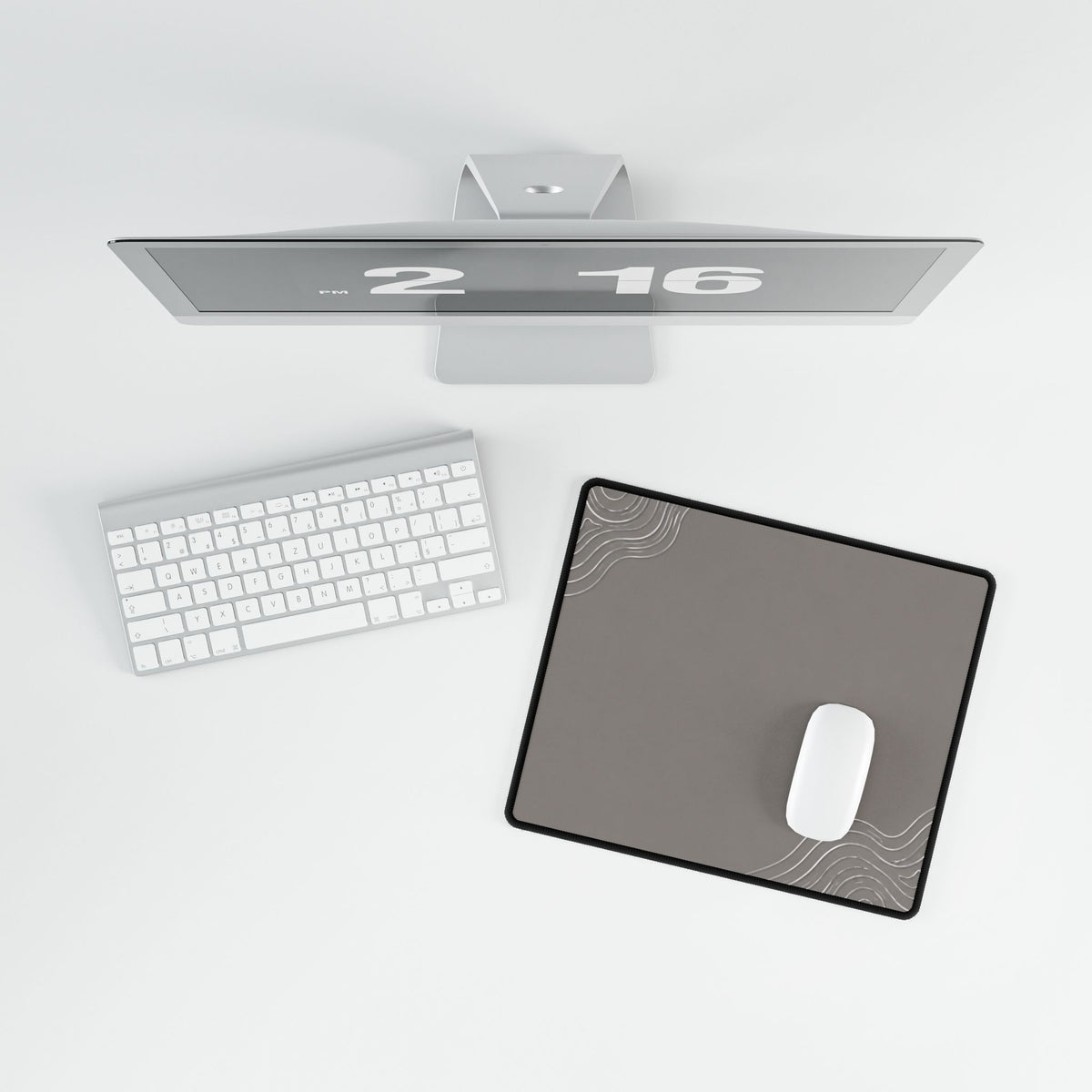 Overhead view of Minimal Stone Grey compact desk mat with a mouse beside the keyboard.