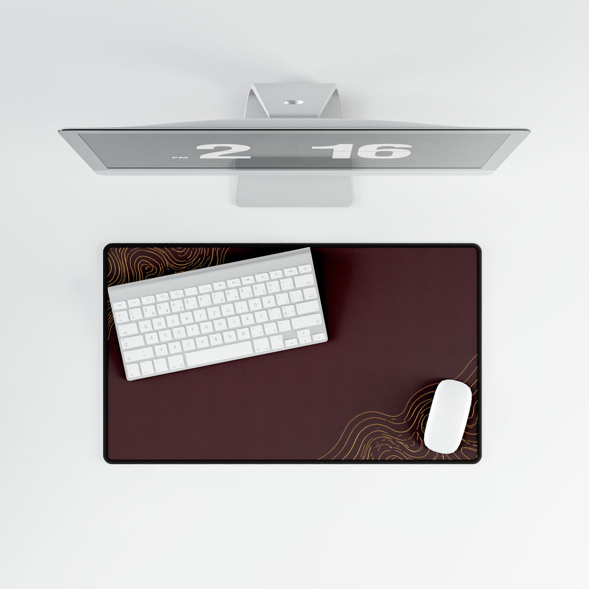 Overhead view of Minimal Burgundy medium-format desk mat on a white desk.