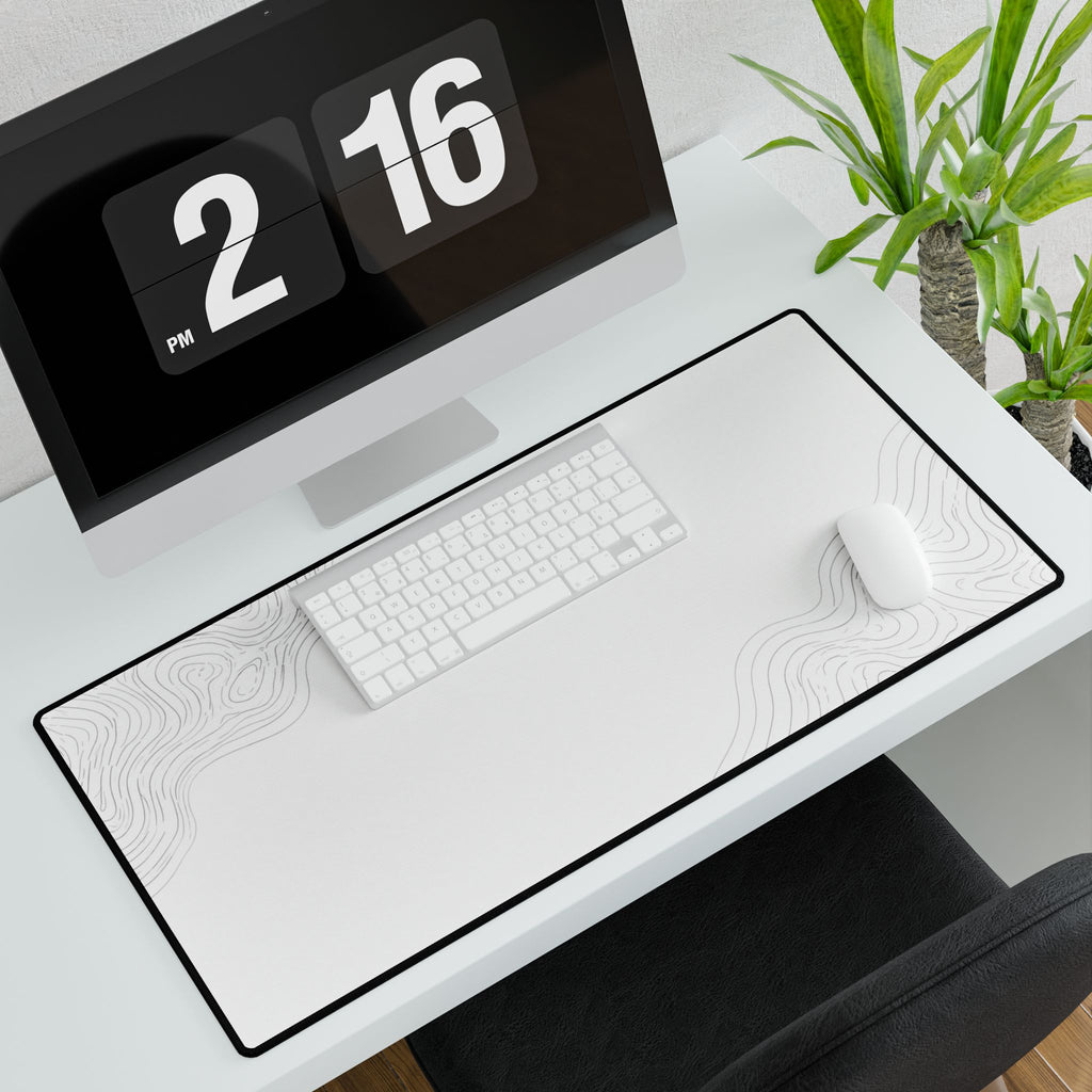 Minimal White desk mat in a wide format, shown with a keyboard and mouse on a white desk.