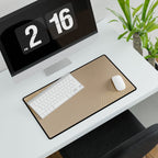 Minimal Beige medium-format desk mat beneath a white keyboard and mouse, viewed at an angle.