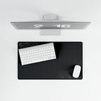 Overhead view of Minimal Charcoal medium-format desk mat on a white desk.
