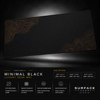 Minimal Black desk mat floating against a dark studio background.