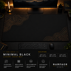 Minimal Black desk mat in a dark workstation with a keyboard, mouse and warm monitor lighting.