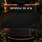 Minimal Black desk mat with muted gold-toned contour lines on black, shown in a warm, dark desk setup.