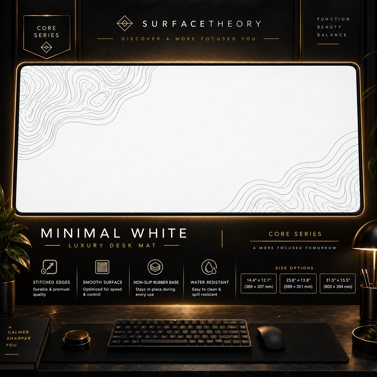Minimal White desk mat in a gold-toned display frame above a keyboard.