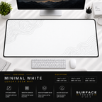 Minimal White desk mat beneath a monitor on a bright desk with a white keyboard and mouse.