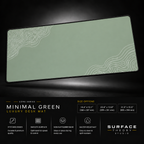 Minimal Green desk mat floating against a dark studio background.
