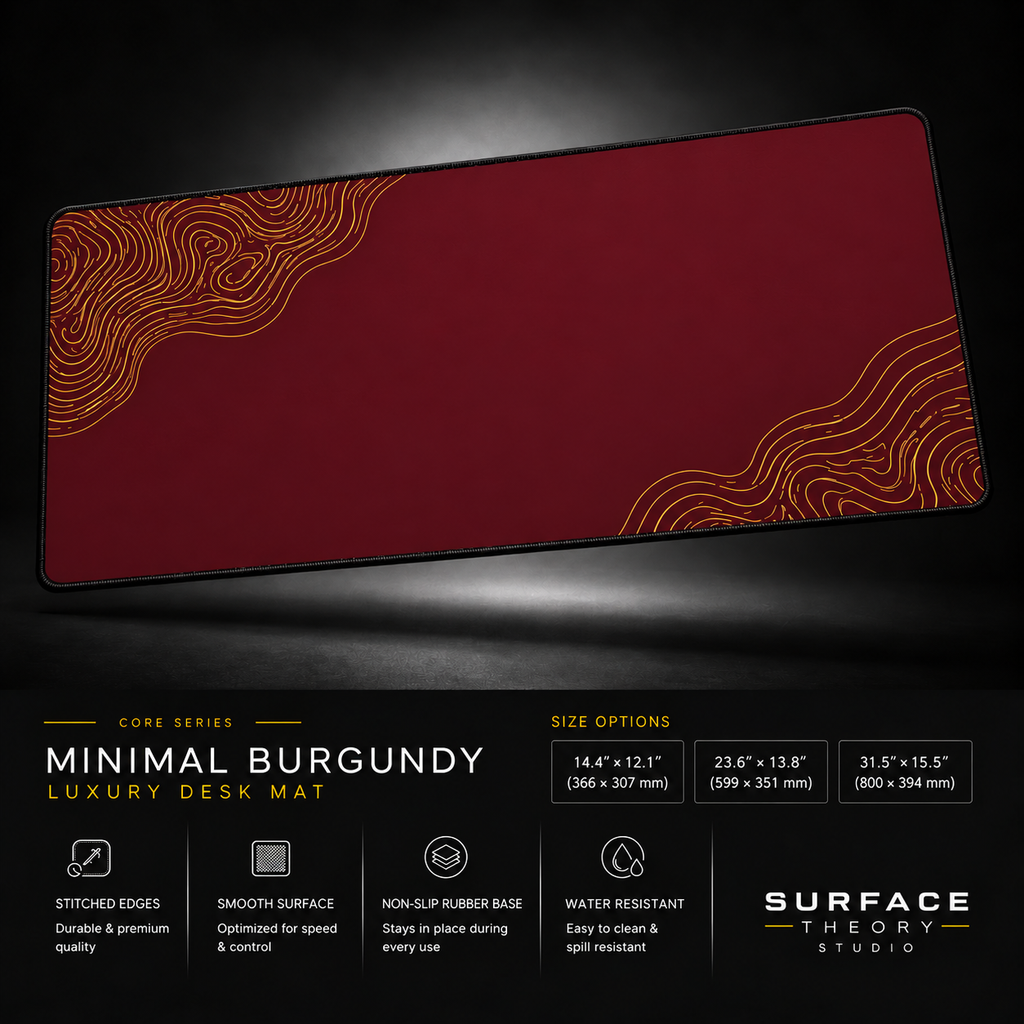 Minimal Burgundy desk mat floating against a dark studio background.