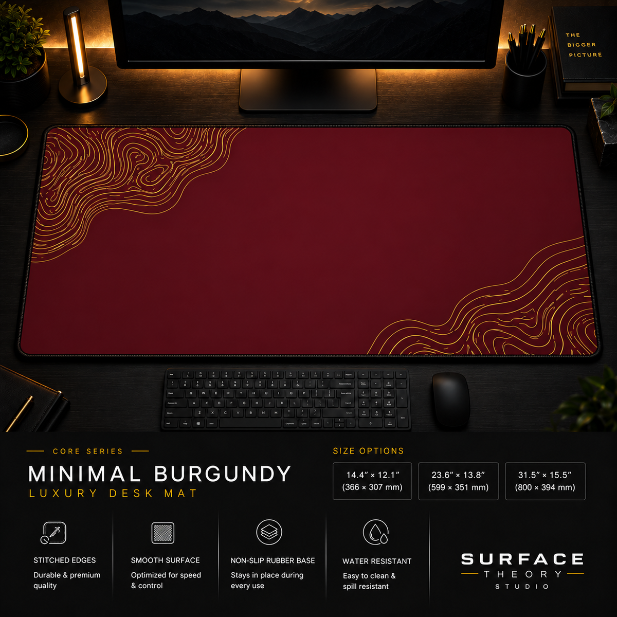 Minimal Burgundy desk mat in a dark workstation with a keyboard, mouse and warm monitor lighting.