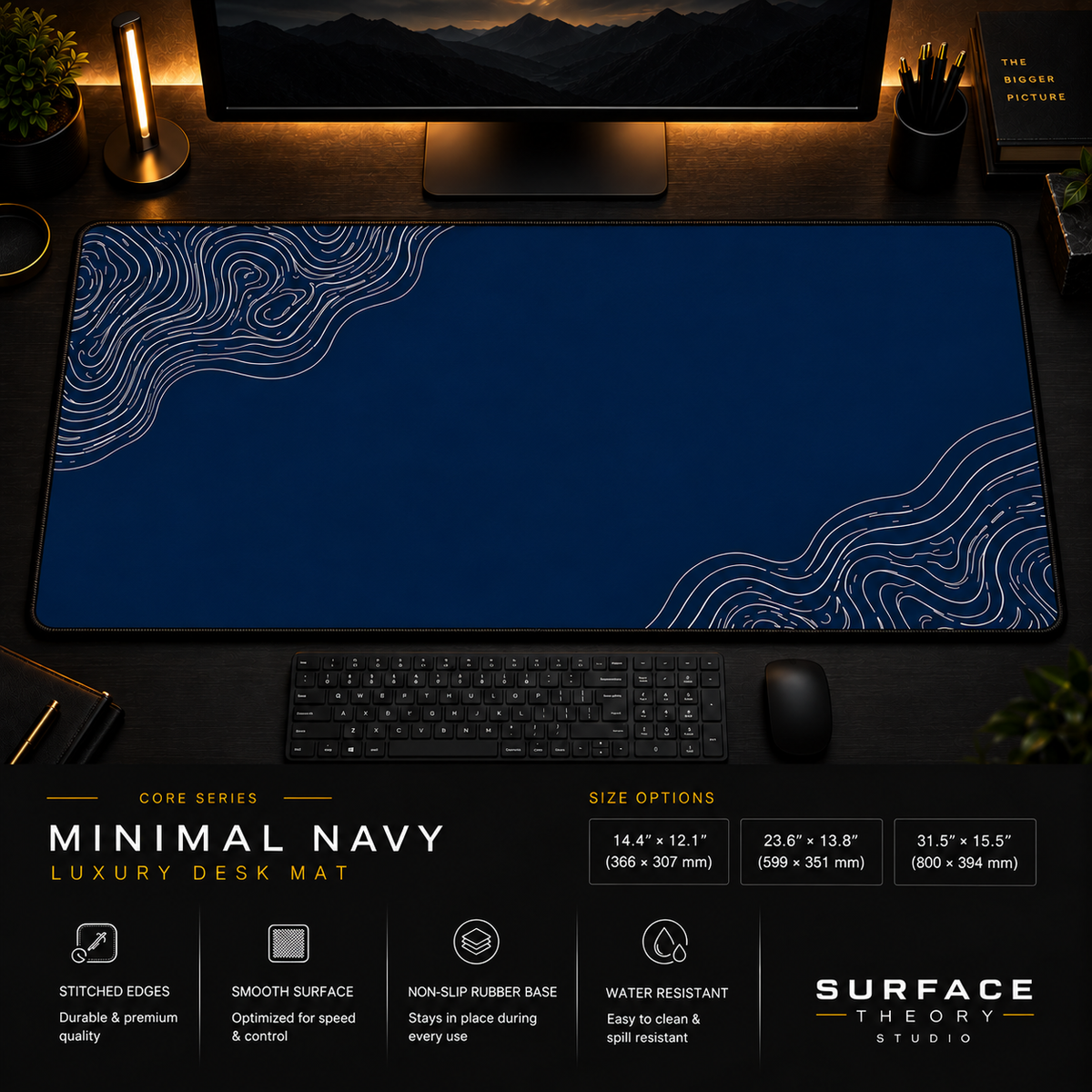 Minimal Navy desk mat in a dark workstation with a keyboard, mouse and warm monitor lighting.