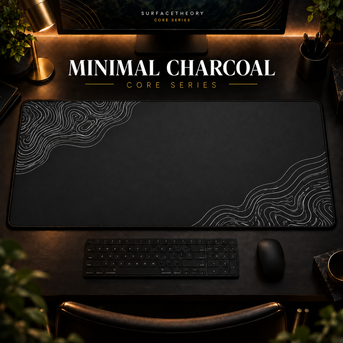 Minimal Charcoal desk mat with light contour lines on charcoal grey, shown in a warm, dark desk setup.