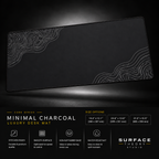 Minimal Charcoal desk mat floating against a dark studio background.