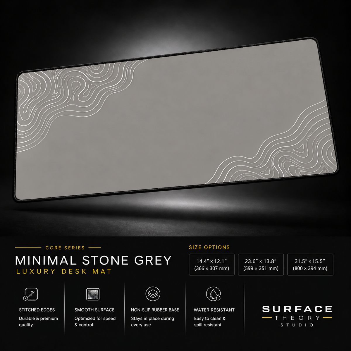 Minimal Stone Grey desk mat floating against a dark studio background.