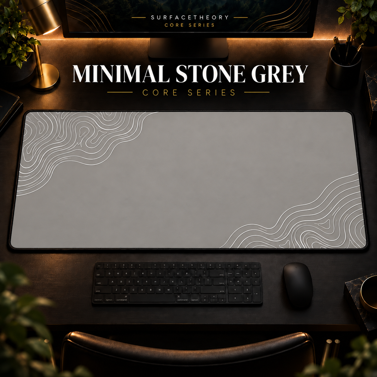 Minimal Stone Grey desk mat with white contour lines on warm grey, shown in a warm, dark desk setup.