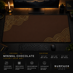Minimal Chocolate desk mat in a dark workstation with a keyboard, mouse and warm monitor lighting.