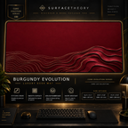 Burgundy Evolution desk mat in a gold-toned showcase frame above a keyboard.