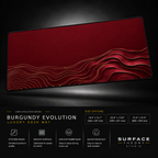 Burgundy Evolution desk mat floating against a dark studio background.