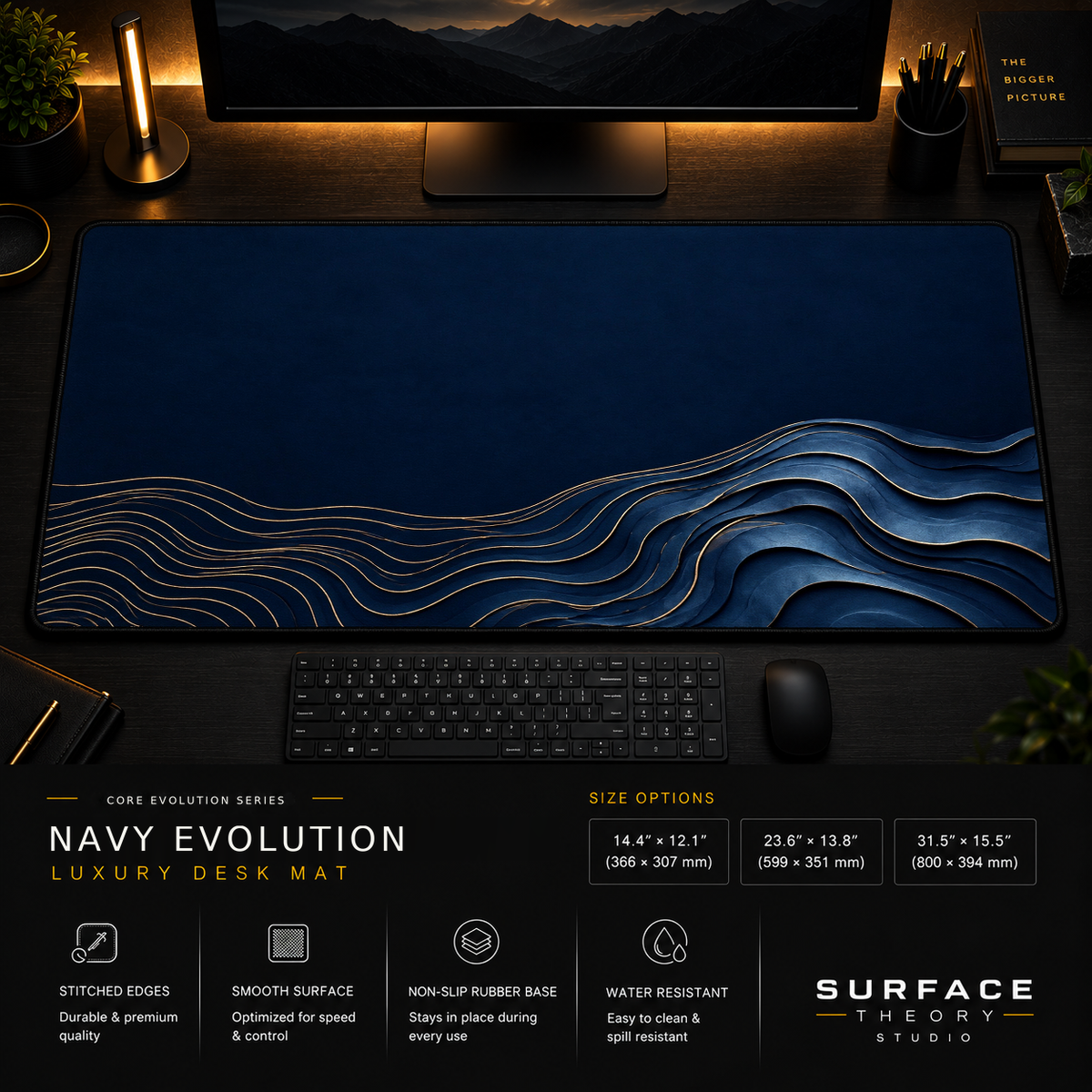 Navy Evolution desk mat in a dark workstation with warm monitor lighting.