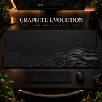 Graphite Evolution desk mat, graphite grey with grey contours widening into layered curves, in a warm, dark workspace.