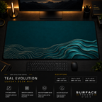 Teal Evolution desk mat in a dark workstation with warm monitor lighting.