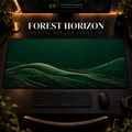 Forest Horizon desk mat, deep forest green with gold-toned landscape contours, in a warm, dark workspace.