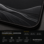 Close-up of Charcoal Horizon printed landscape artwork and black stitched corner.