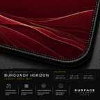Close-up of Burgundy Horizon printed landscape artwork and black stitched corner.