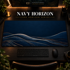 Navy Horizon desk mat, navy blue with gold-toned landscape contours, in a warm, dark workspace.