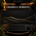 Obsidian Horizon desk mat in a warm, dark workspace.