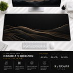 Obsidian Horizon desk mat beneath a monitor on a bright desk with a white keyboard and mouse.