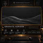 Graphite Horizon desk mat in a gold-toned showcase frame above a keyboard.