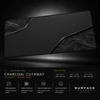 Charcoal Cutaway desk mat floating against a dark studio background.