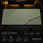 Sage Cutaway desk mat in a dark workstation with warm monitor lighting.