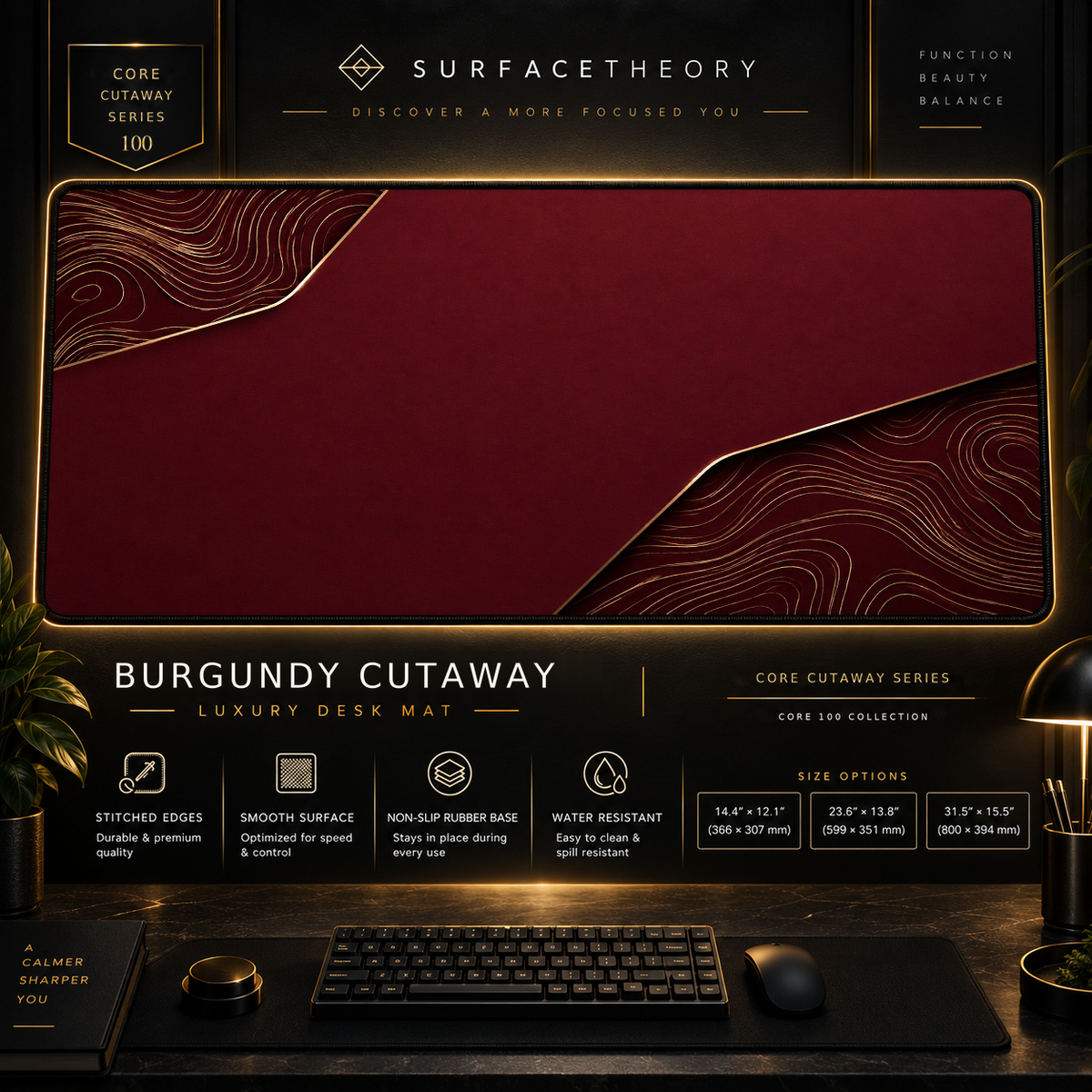 Burgundy Cutaway desk mat in a gold-toned showcase frame above a keyboard.