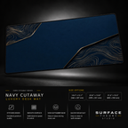 Navy Cutaway desk mat floating against a dark studio background.