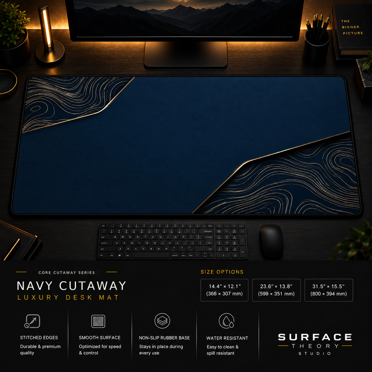 Navy Cutaway desk mat in a dark workstation with warm monitor lighting.