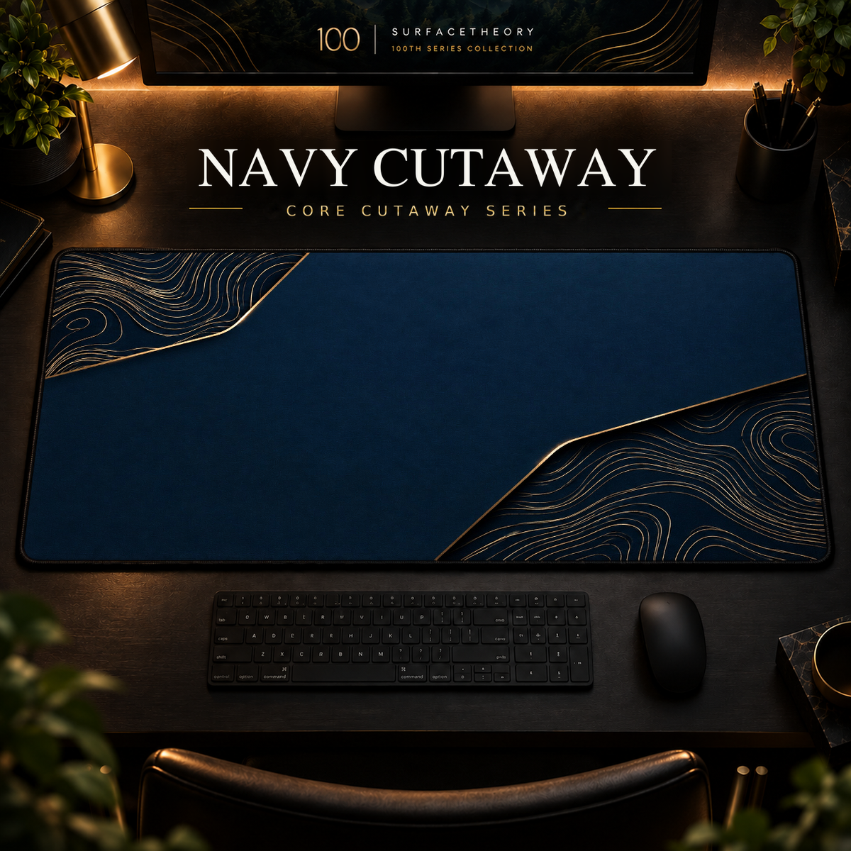 Navy Cutaway desk mat, navy blue with gold-toned contours in opposing corners, in a warm, dark workspace.