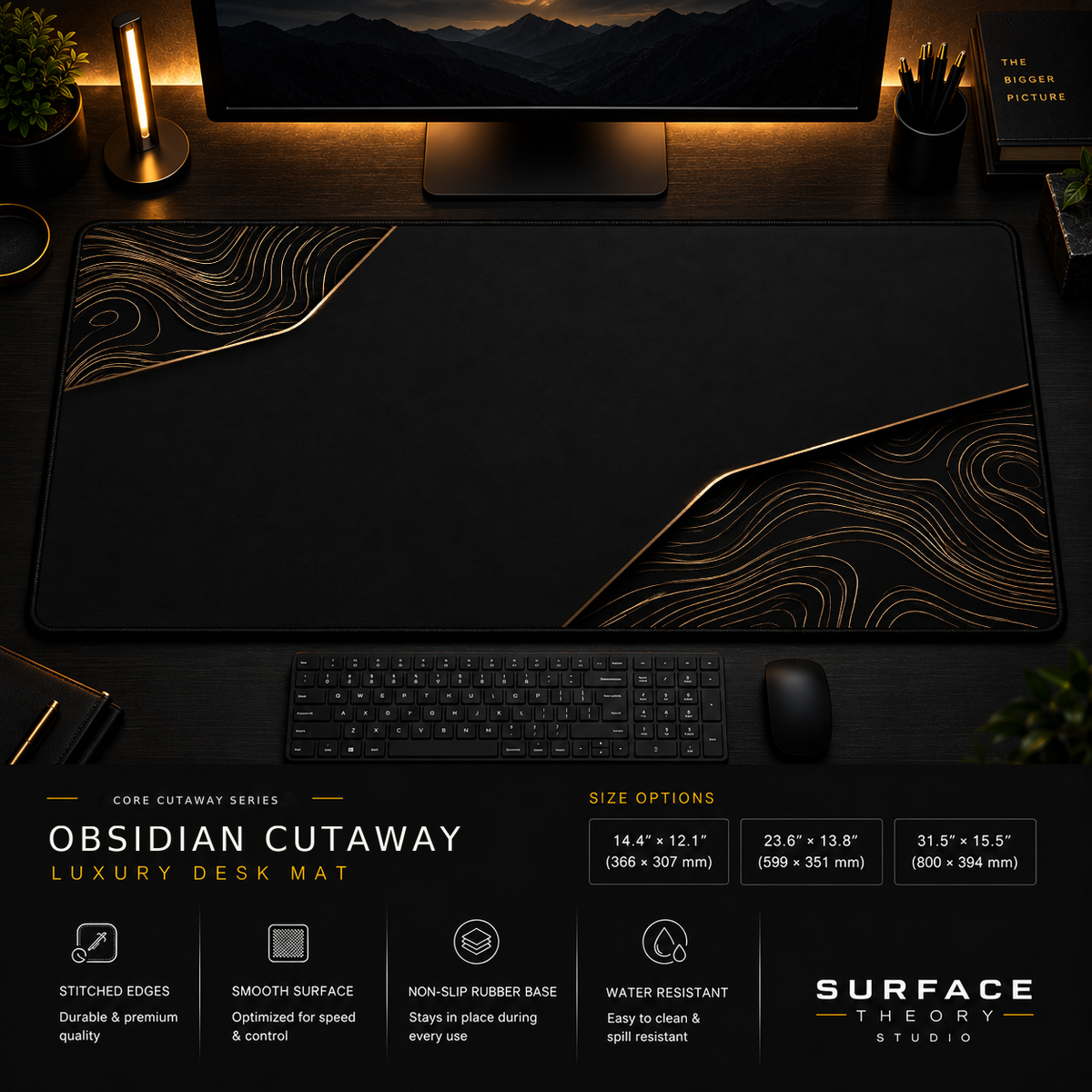 Obsidian Cutaway desk mat in a dark workstation with warm monitor lighting.