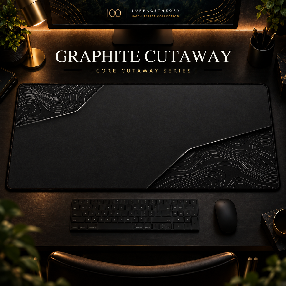 Graphite Cutaway desk mat, graphite grey with grey contours in opposing corners, in a warm, dark workspace.