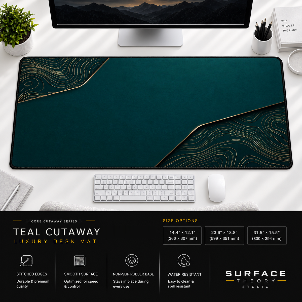 Teal Cutaway desk mat beneath a monitor on a bright desk with a white keyboard and mouse.