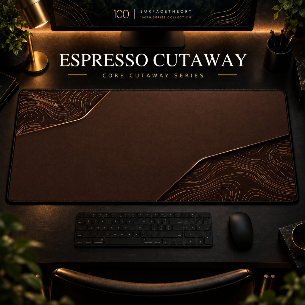Espresso Cutaway desk mat, espresso brown with copper-toned contours in opposing corners, in a warm, dark workspace.