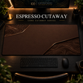 Espresso Cutaway desk mat, espresso brown with copper-toned contours in opposing corners, in a warm, dark workspace.