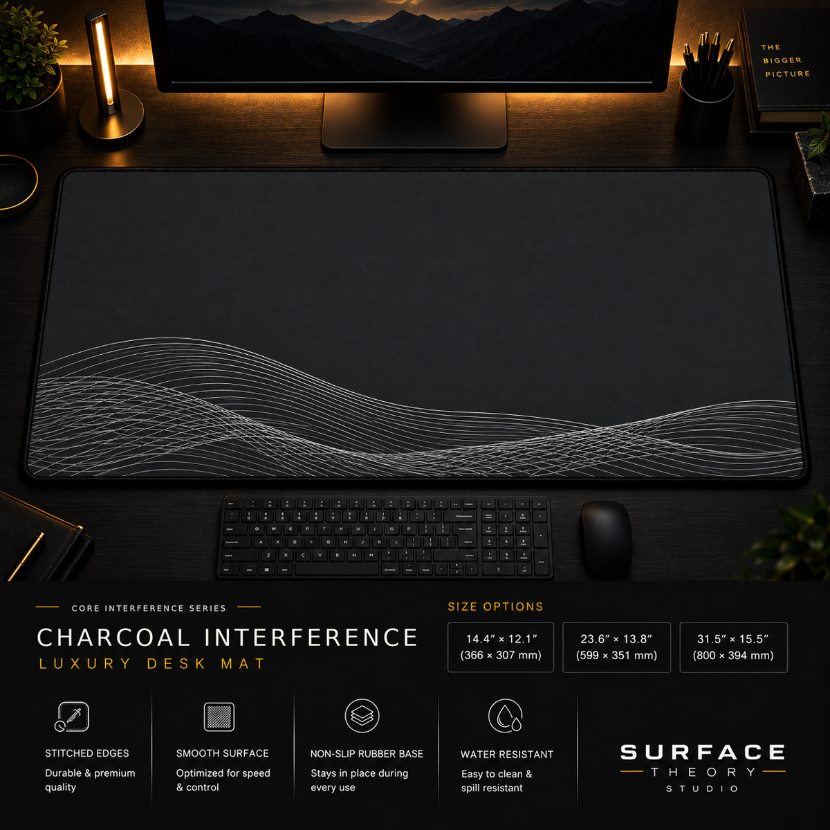 Charcoal Interference desk mat in a dark workstation with warm monitor lighting.