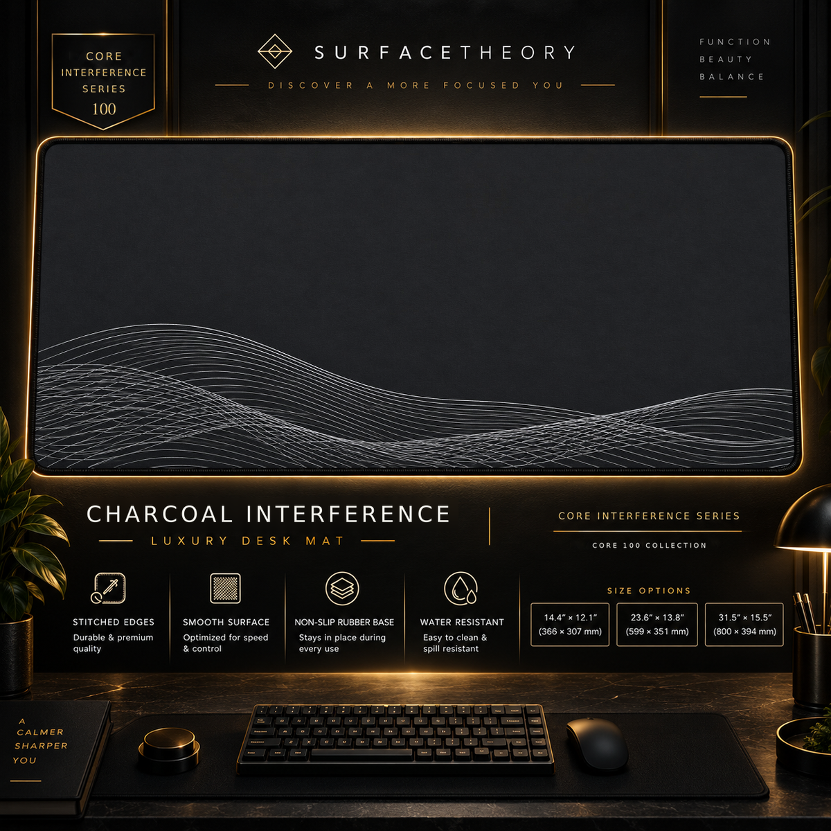 Charcoal Interference desk mat in a gold-toned showcase frame above a keyboard.