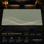 Sage Interference desk mat in a dark workstation with warm monitor lighting.