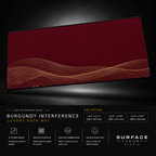 Burgundy Interference desk mat floating against a dark studio background.