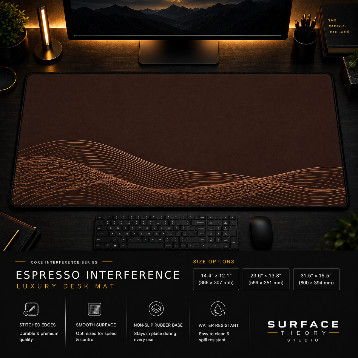 Espresso Interference desk mat in a dark workstation with warm monitor lighting.