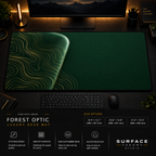 Forest Optic desk mat in a dark workstation with warm monitor lighting.