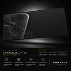 Charcoal Optic desk mat floating against a dark studio background.