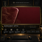 Burgundy Optic desk mat in a gold-toned showcase frame above a keyboard.